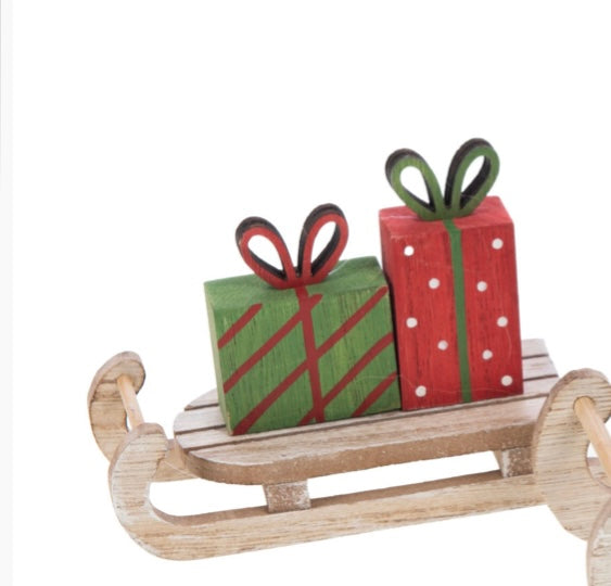 Slitte con pacchetto regalo: un dettaglio con incanta